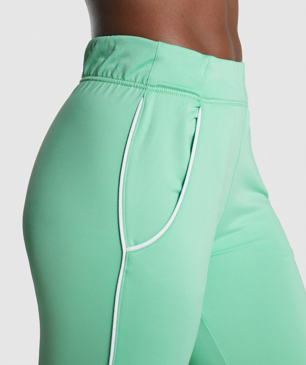gymshark-recess-joggers-light-green-white-logo