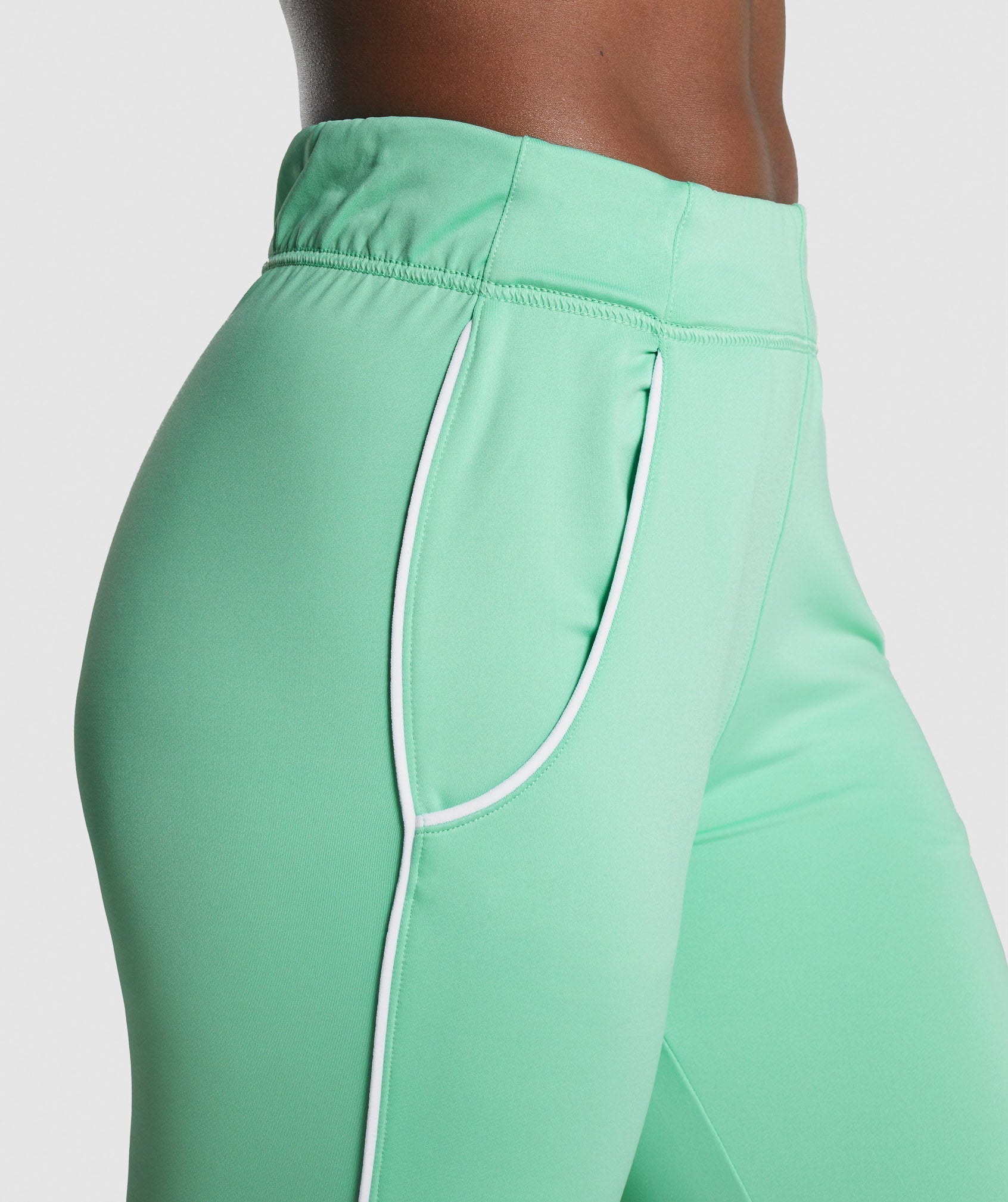 gymshark-recess-joggers-light-green-white-logo