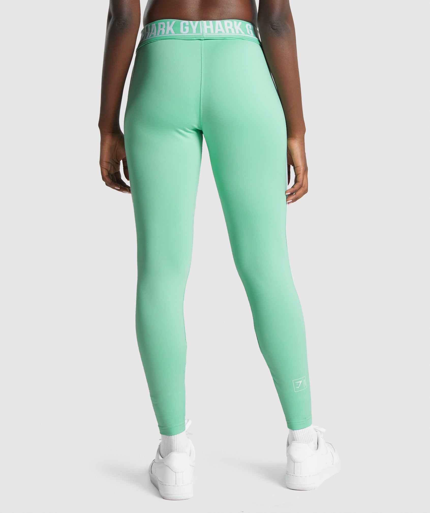 gymshark-recess-joggers-light-green-white-logo