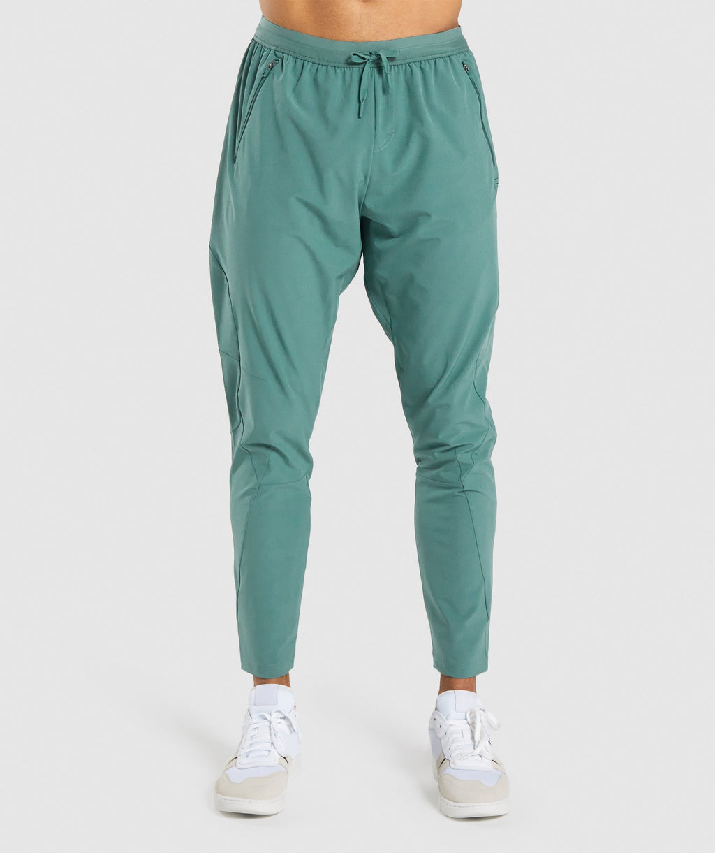 gymshark-retake-woven-joggers-dark-green