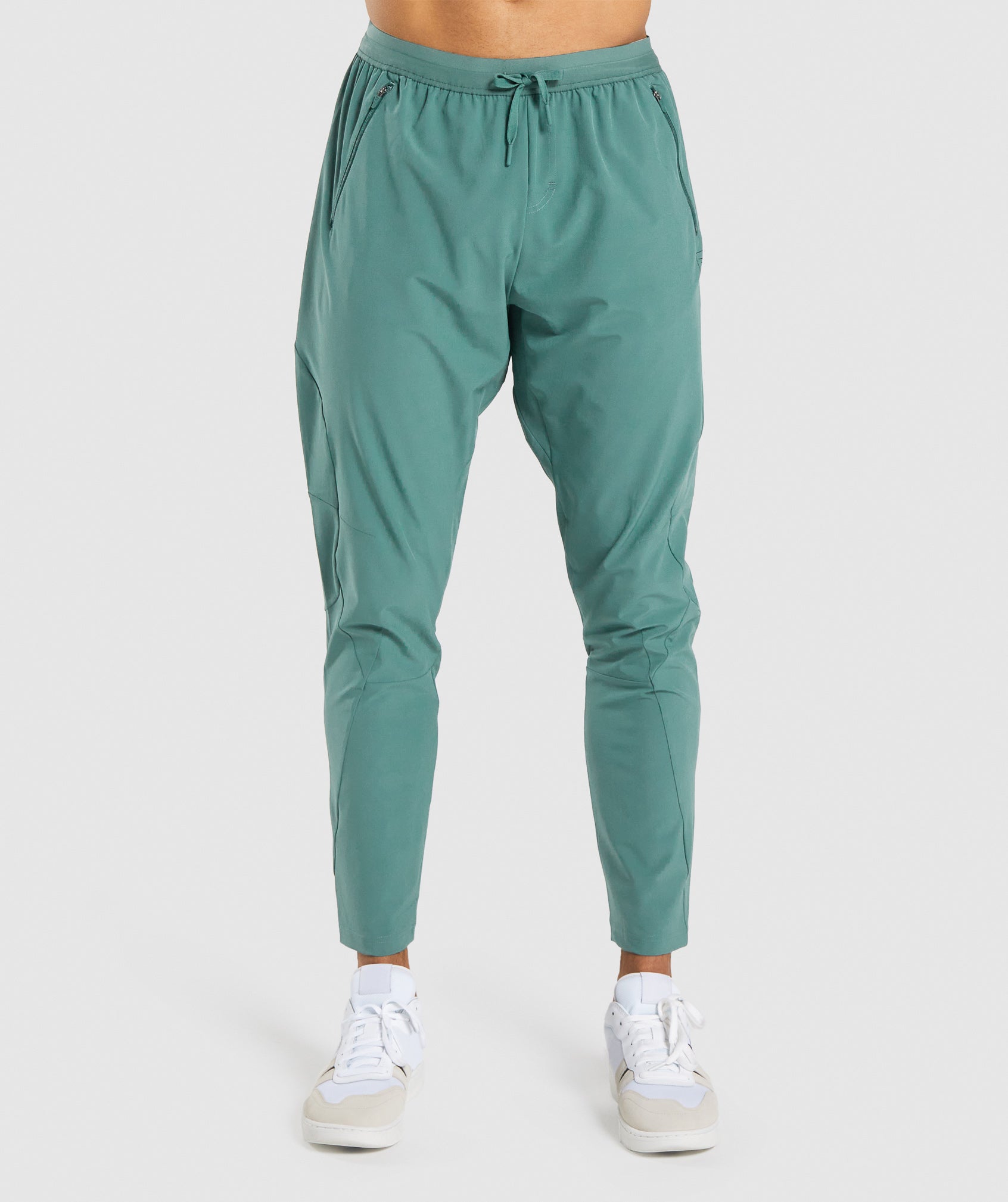 gymshark-retake-woven-joggers-dark-green