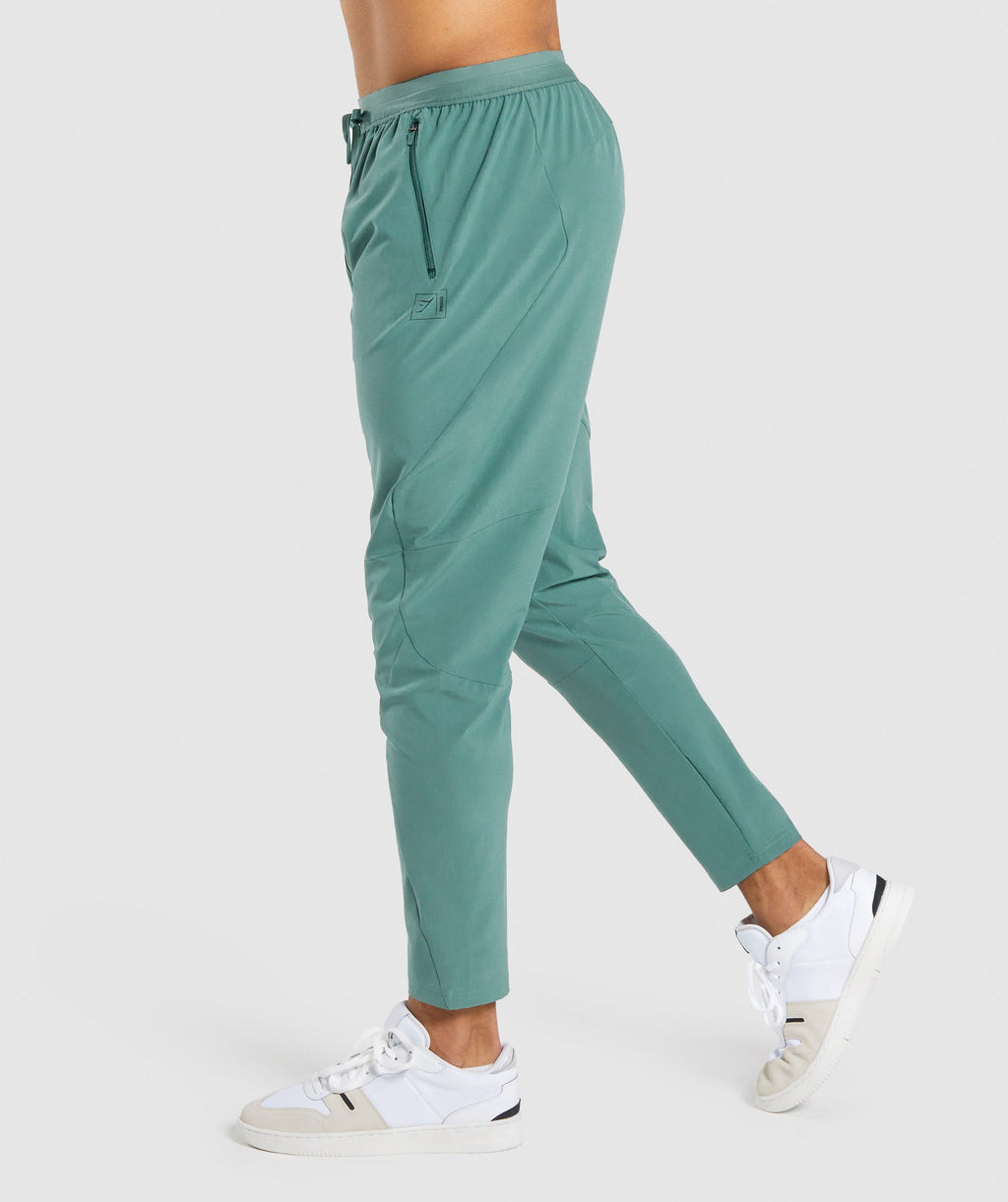 gymshark-retake-woven-joggers-dark-green