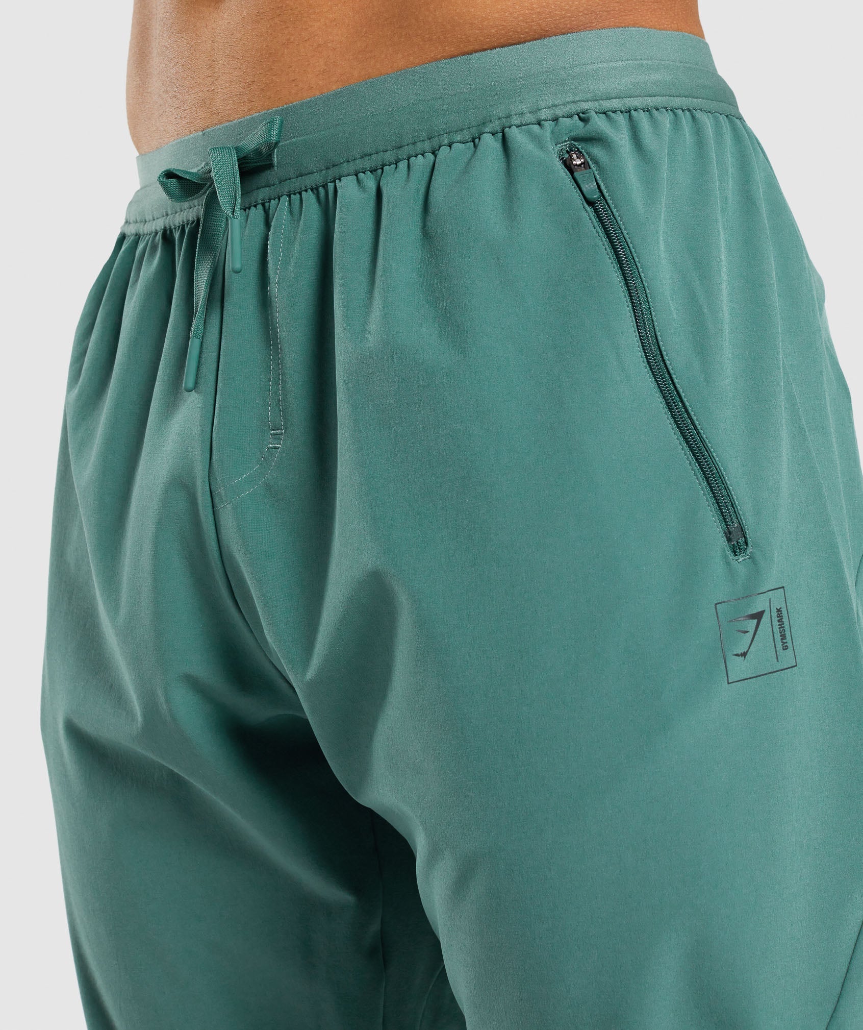 gymshark-retake-woven-joggers-dark-green