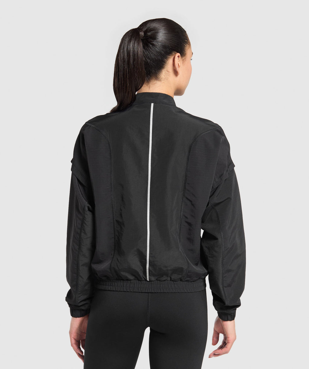gymshark-running-1-4-zip-track-top-black-aw24