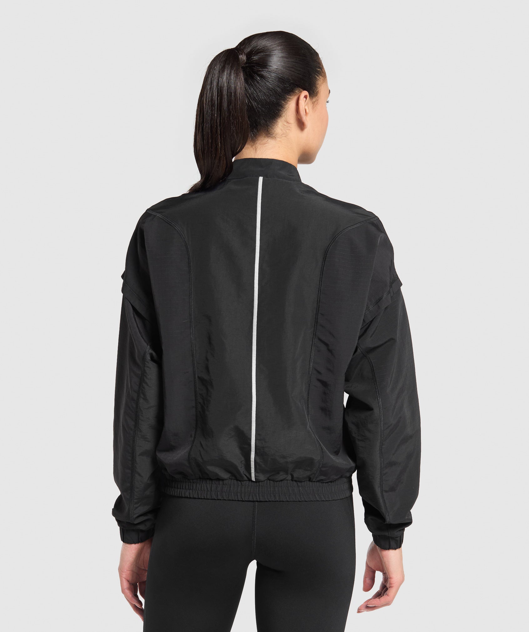 gymshark-running-1-4-zip-track-top-black-aw24