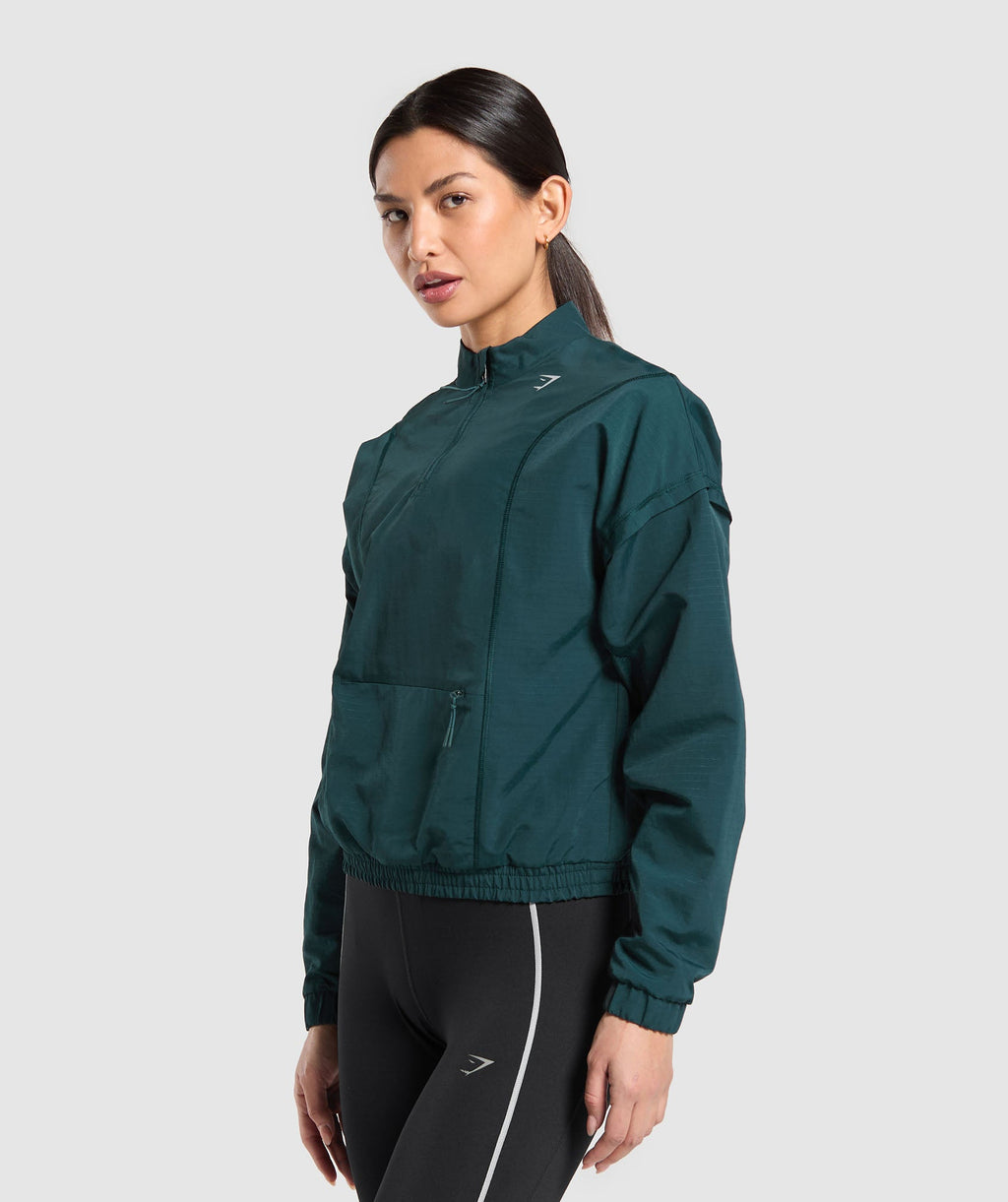 gymshark-running-1-4-zip-track-top-strong-teal-aw24