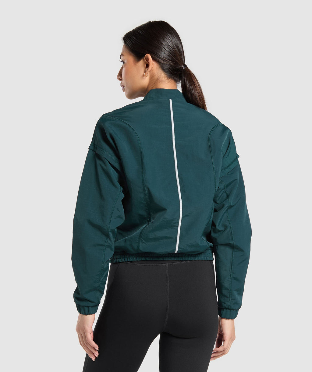 gymshark-running-1-4-zip-track-top-strong-teal-aw24