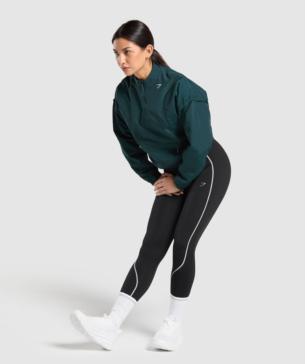 gymshark-running-1-4-zip-track-top-strong-teal-aw24