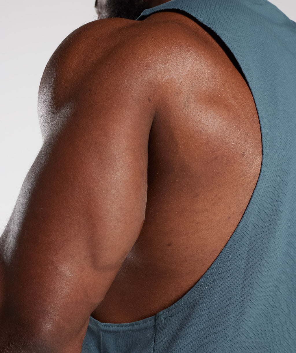 gymshark-react-drop-arm-tank-denim-teal-aw23