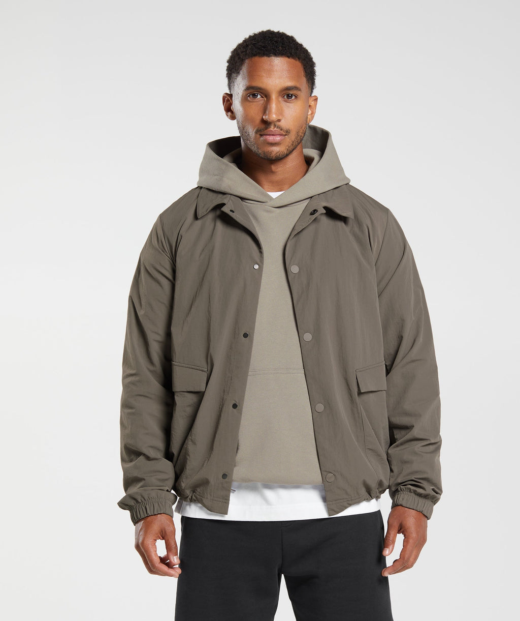 gymshark-rest-day-commute-jacket-camo-brown-aw23