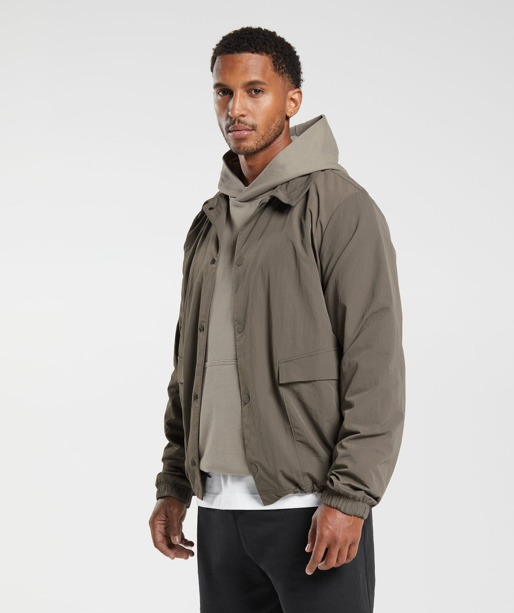 gymshark-rest-day-commute-jacket-camo-brown-aw23