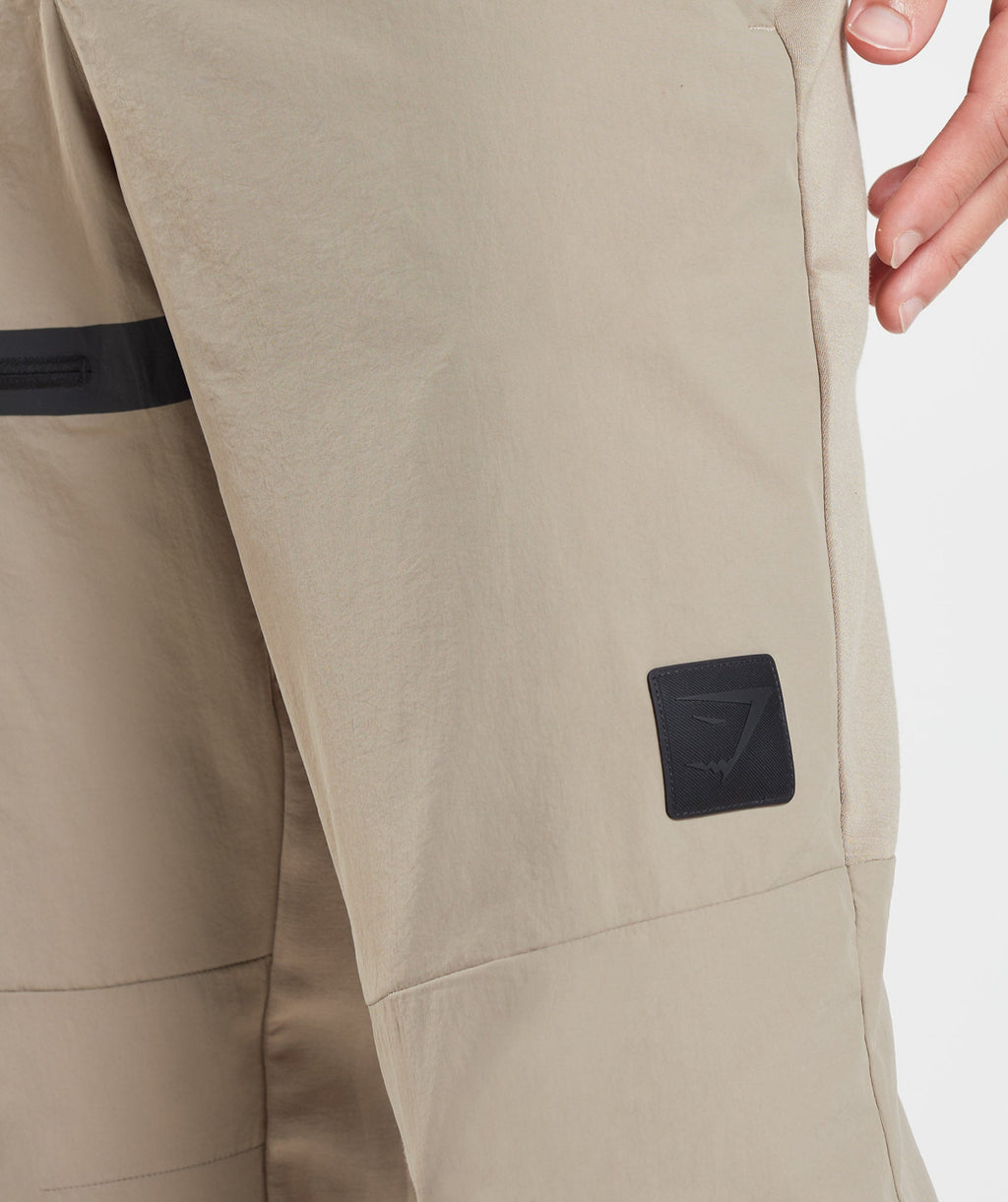 gymshark-retake-woven-joggers-cement-brown-aw22