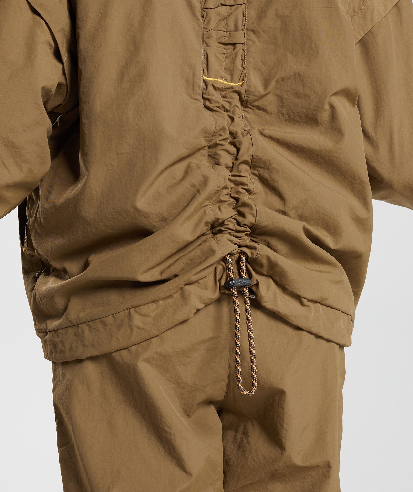 gymshark-retake-woven-jacket-puddle-brown-aw22