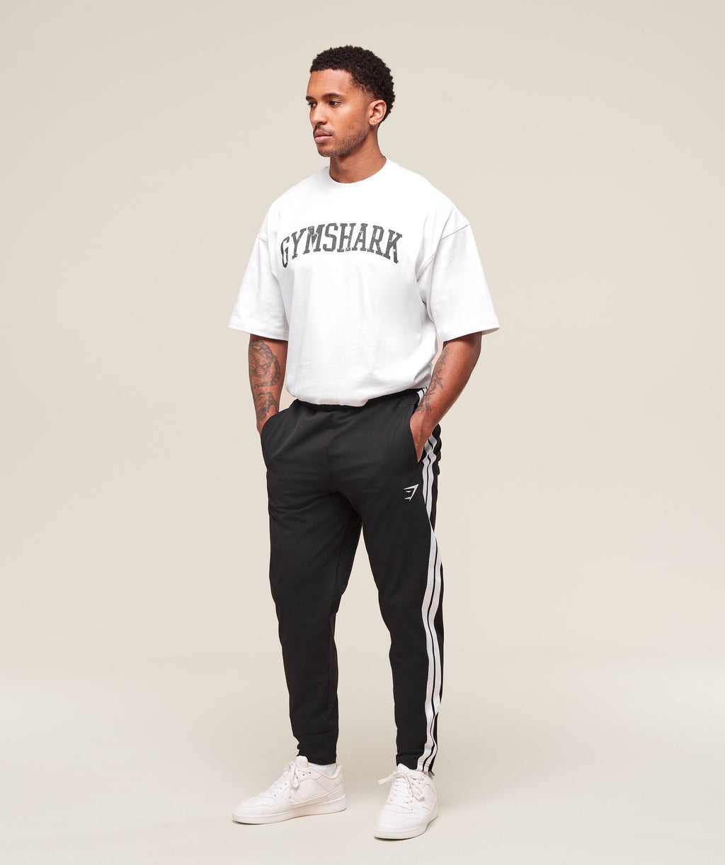 gymshark-retro-side-stripe-joggers-pants-black-ss25