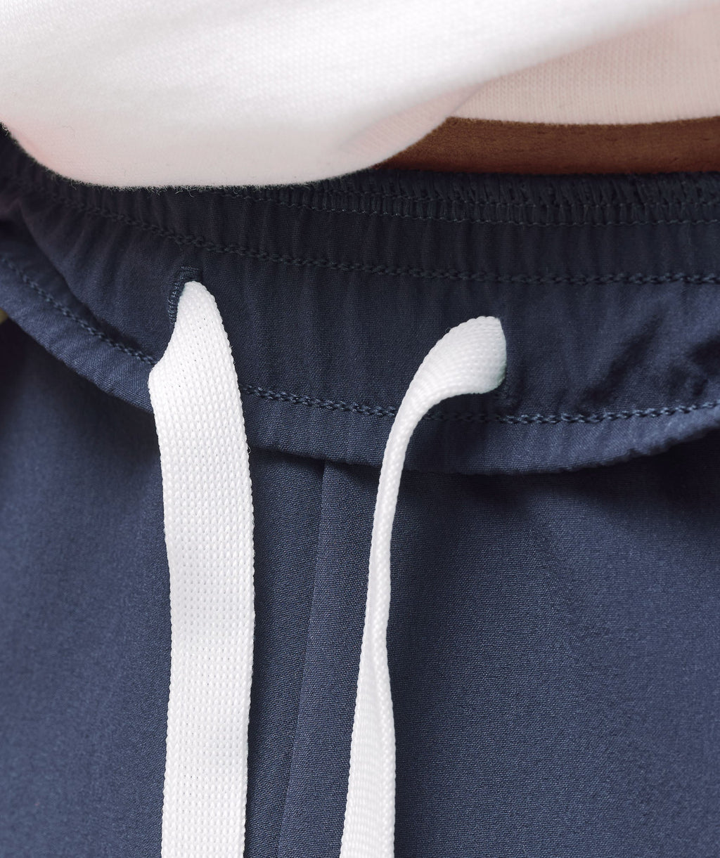 gymshark-retro-side-stripe-joggers-heavy-blue-ss25