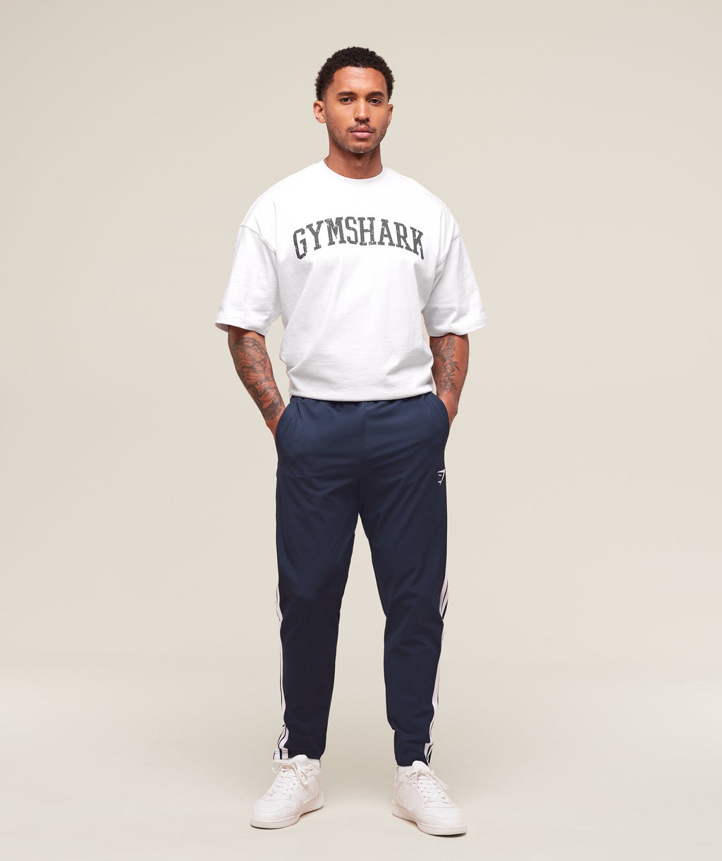 gymshark-retro-side-stripe-joggers-heavy-blue-ss25