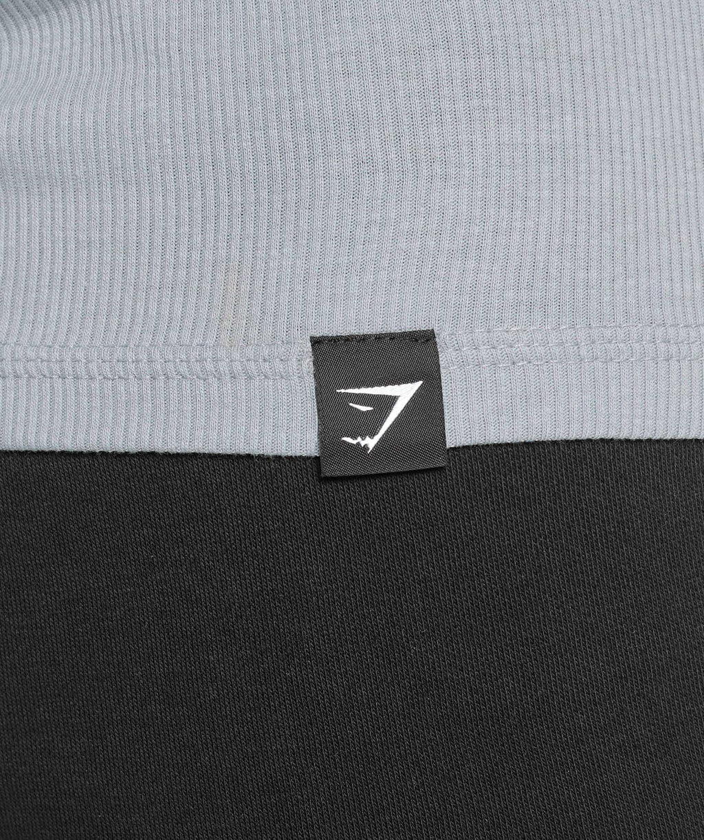 gymshark-ribbed-tank-3pk-denim-grey-pebble-grey-lifestyle-brown-ss25