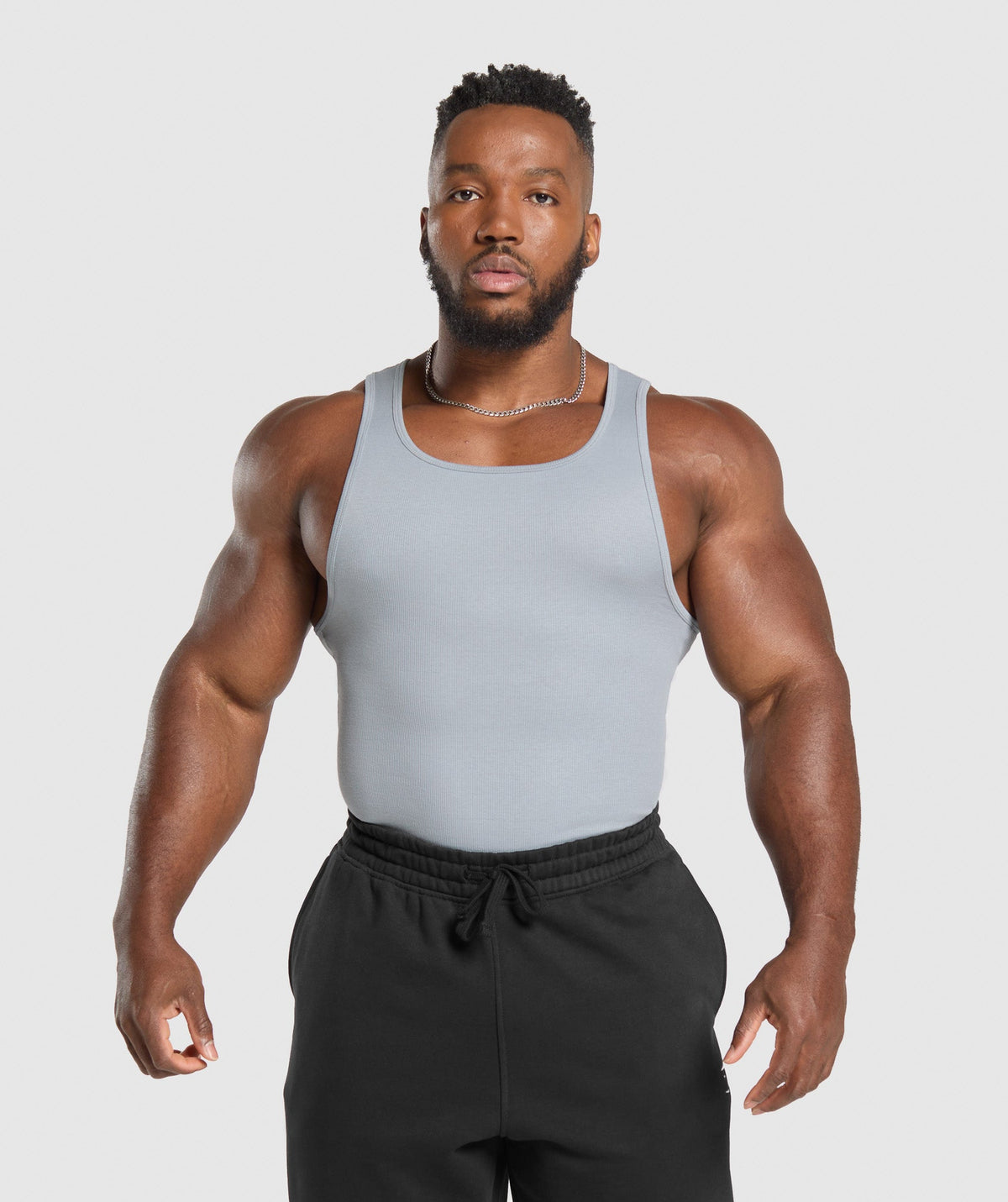 gymshark-ribbed-tank-3pk-denim-grey-pebble-grey-lifestyle-brown-ss25