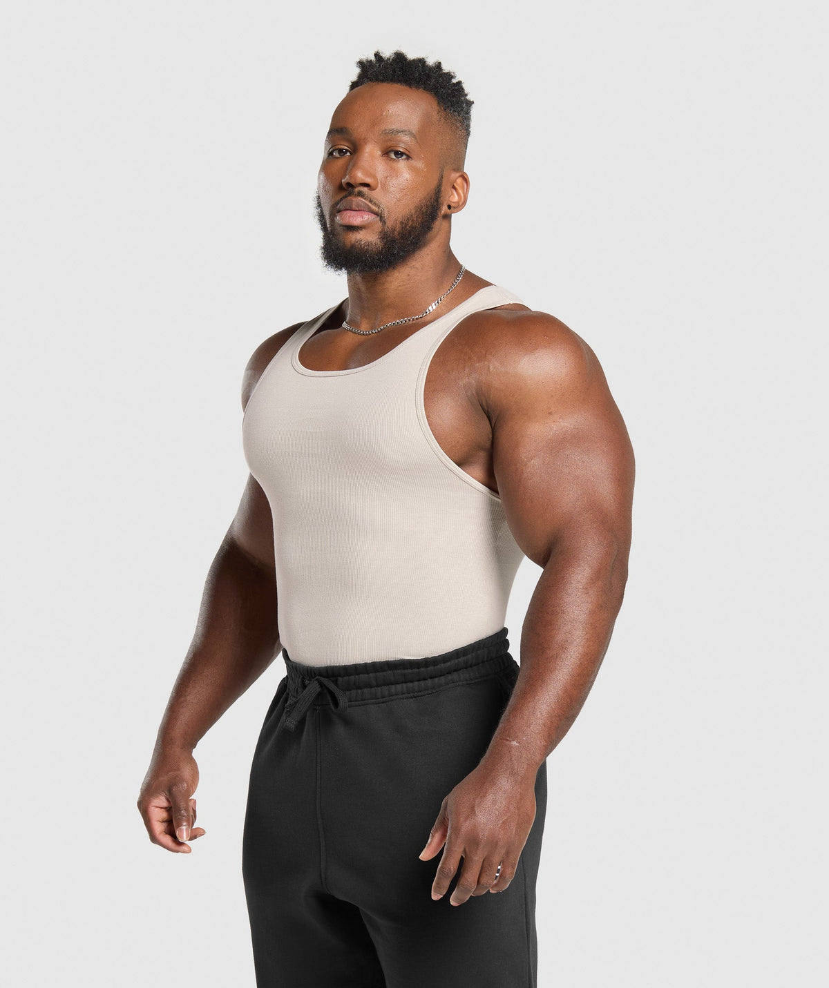 gymshark-ribbed-tank-3pk-denim-grey-pebble-grey-lifestyle-brown-ss25