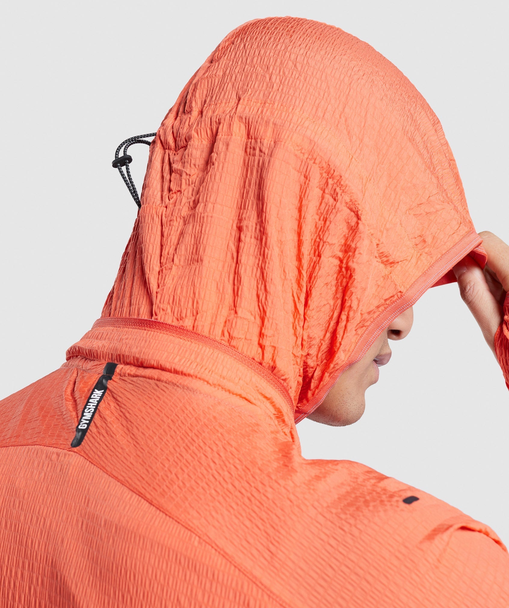 gymshark-speed-windbreaker-papaya-orange-ss22