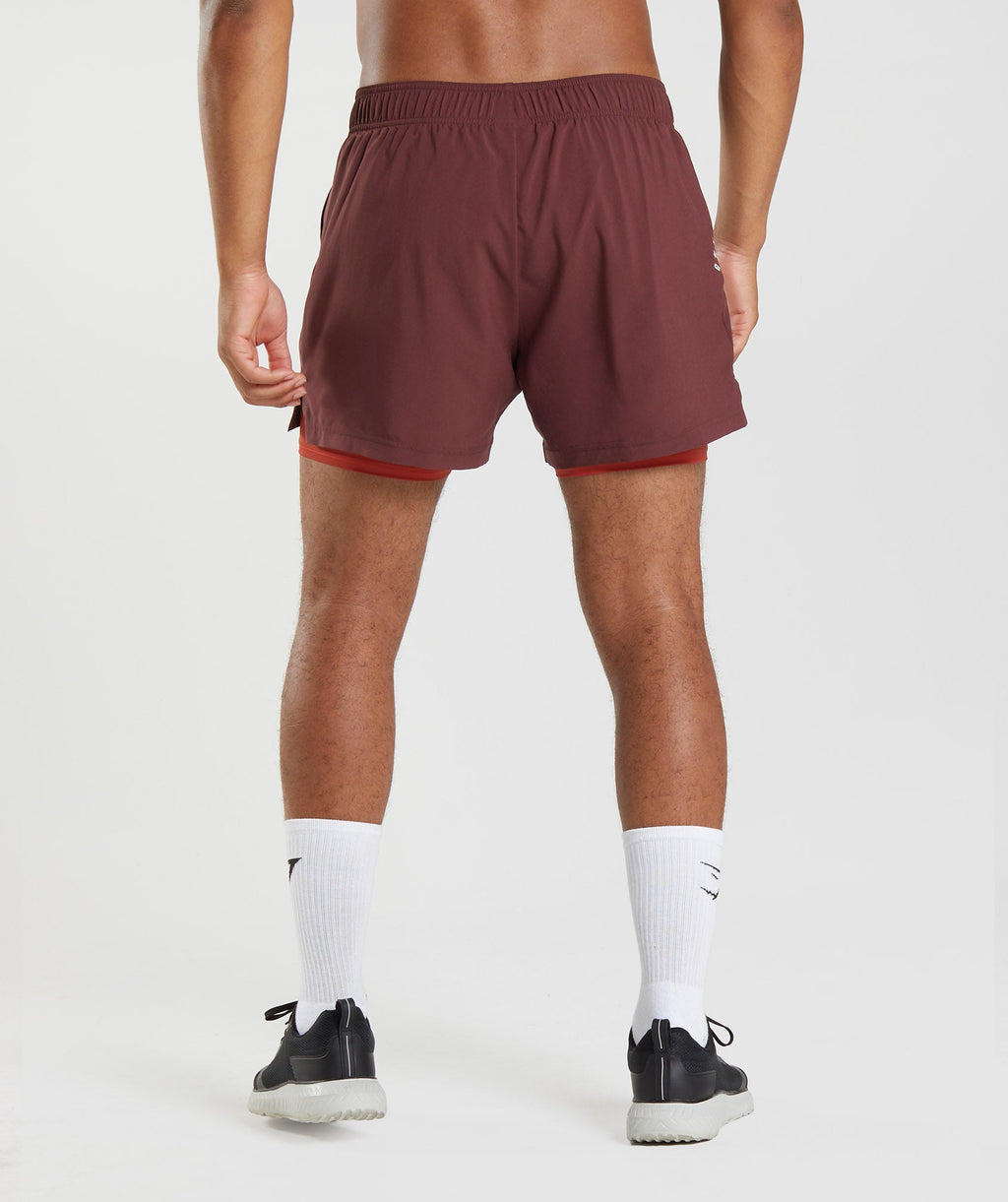 gymshark-sport-5-2-in-1-shorts-baked-maroon-salsa-red-aw22