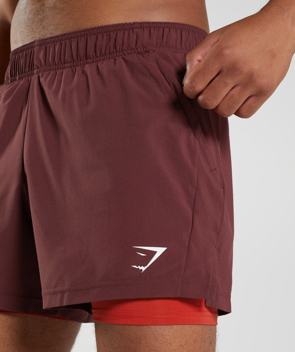 gymshark-sport-5-2-in-1-shorts-baked-maroon-salsa-red-aw22