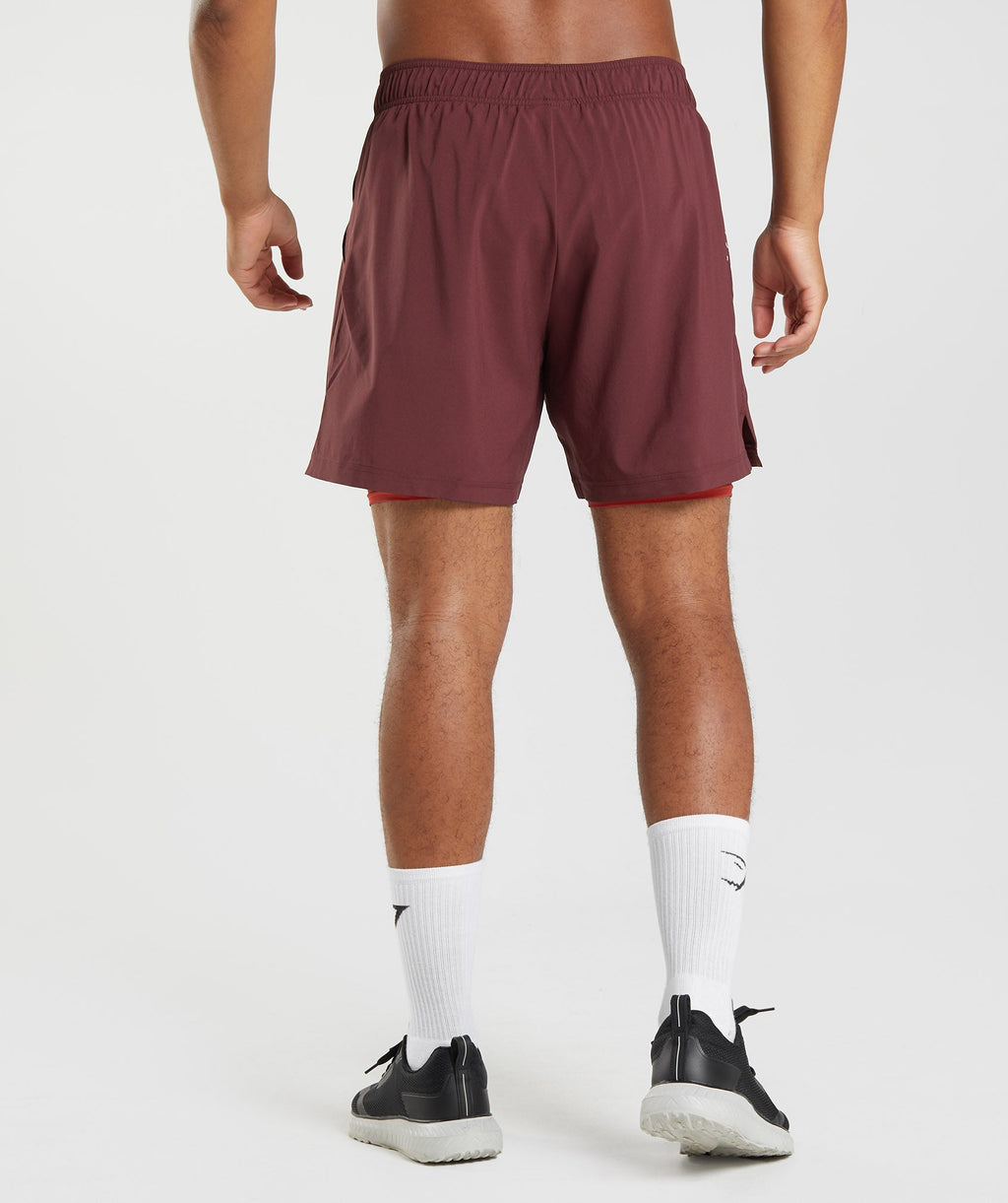 gymshark-sport-7-2-in-1-shorts-baked-maroon-salsa-red-aw22