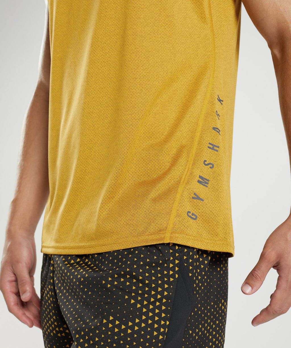 gymshark-sport-tank-turmeric-yellow-black-marl-aw22