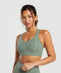 gymshark-stitch-feature-sports-bra-unit-green-ss24