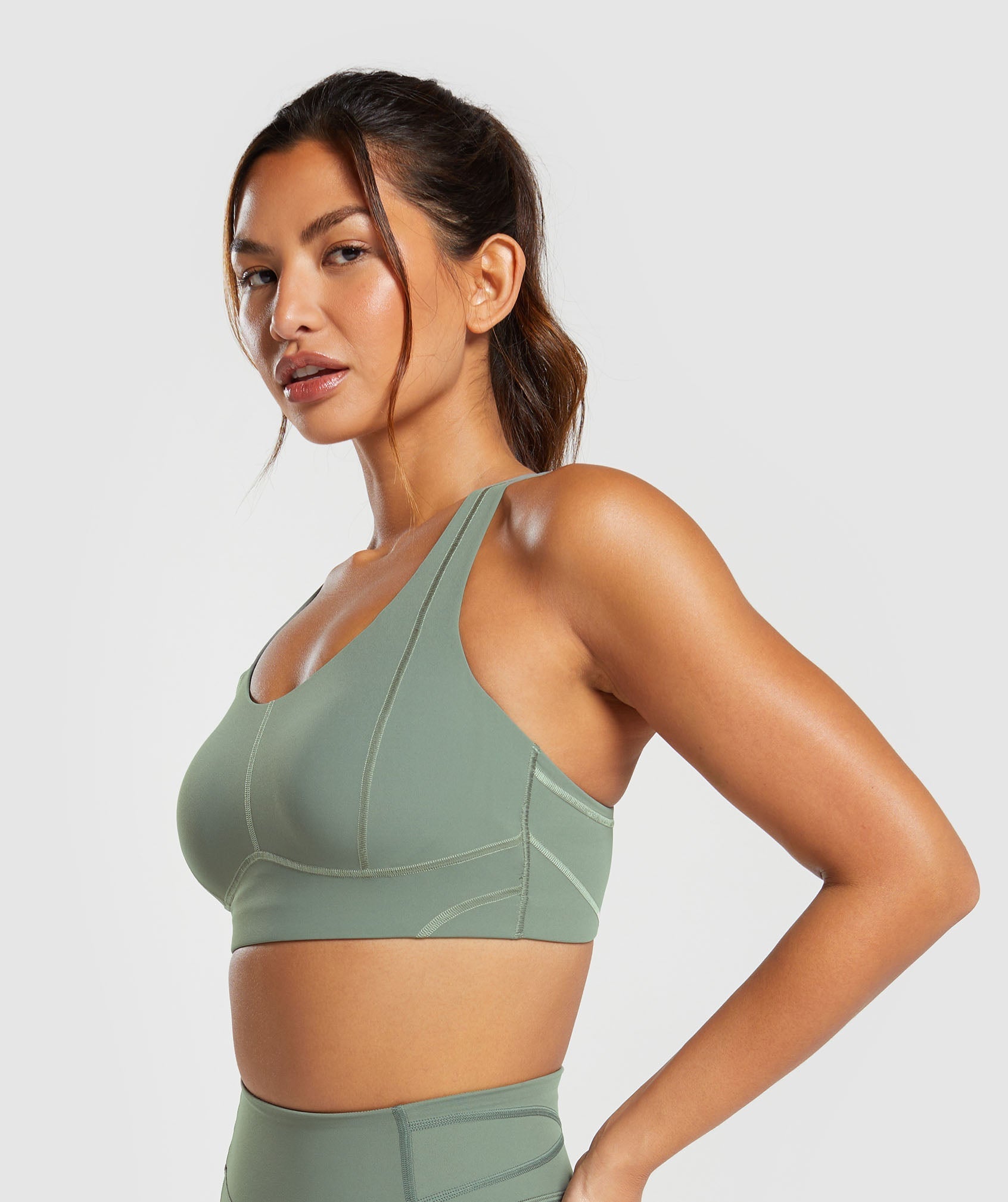 gymshark-stitch-feature-sports-bra-unit-green-ss24