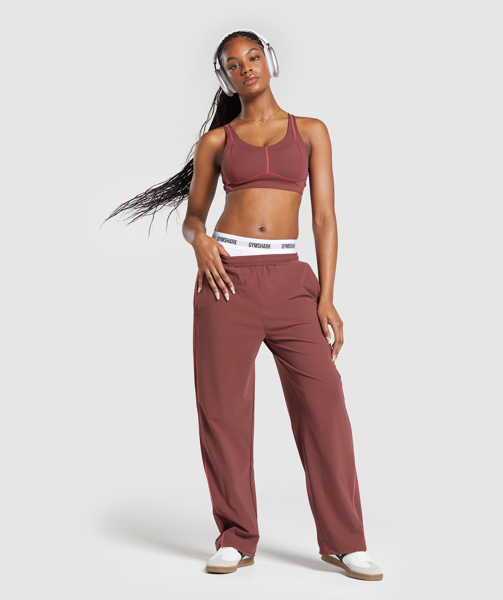 gymshark-stitch-feature-woven-pants-burgundy-brown-ss24