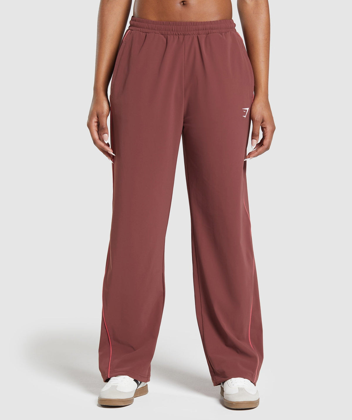 gymshark-stitch-feature-woven-pants-burgundy-brown-ss24