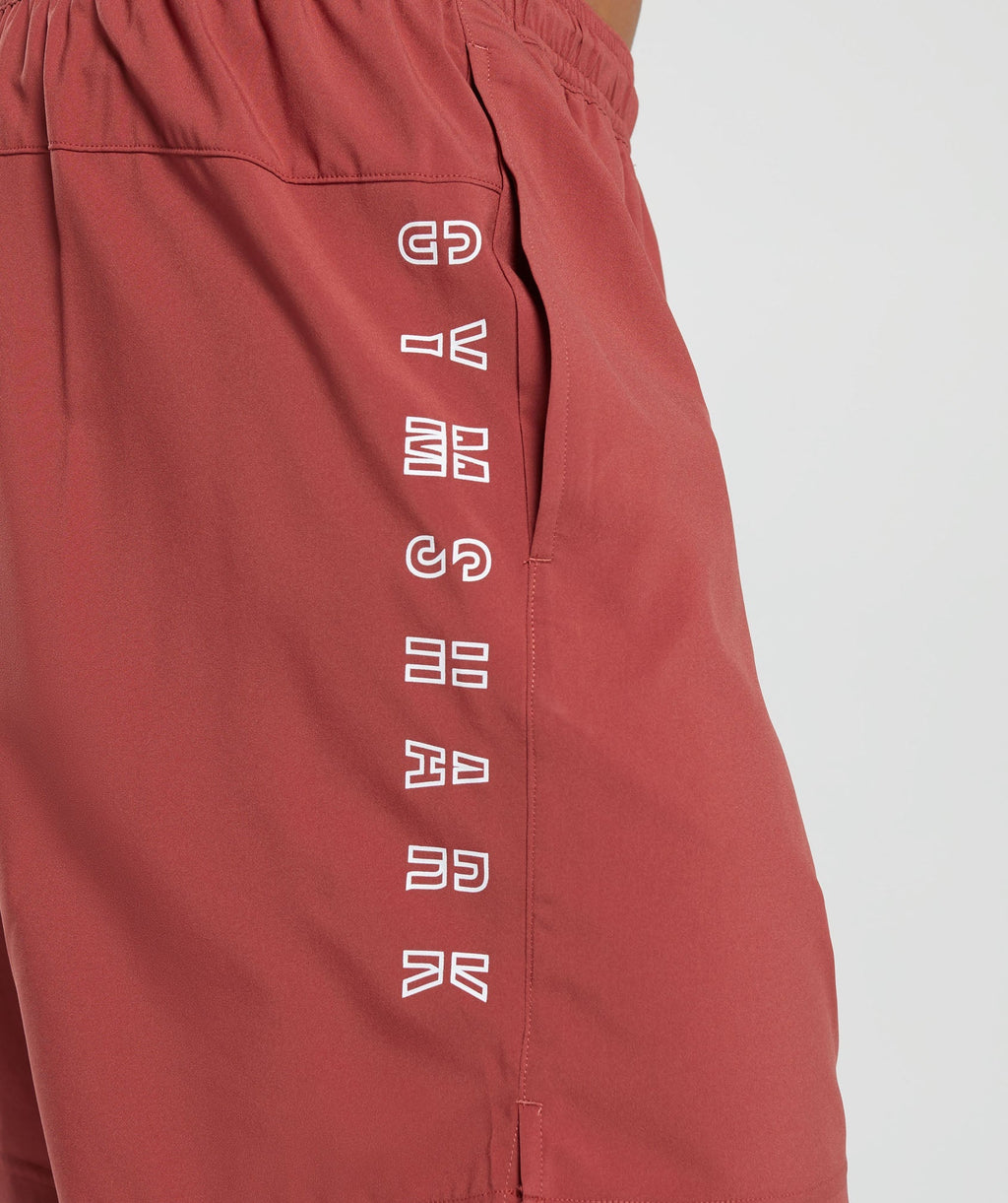 gymshark-strike-shorts-rust-red-aw23
