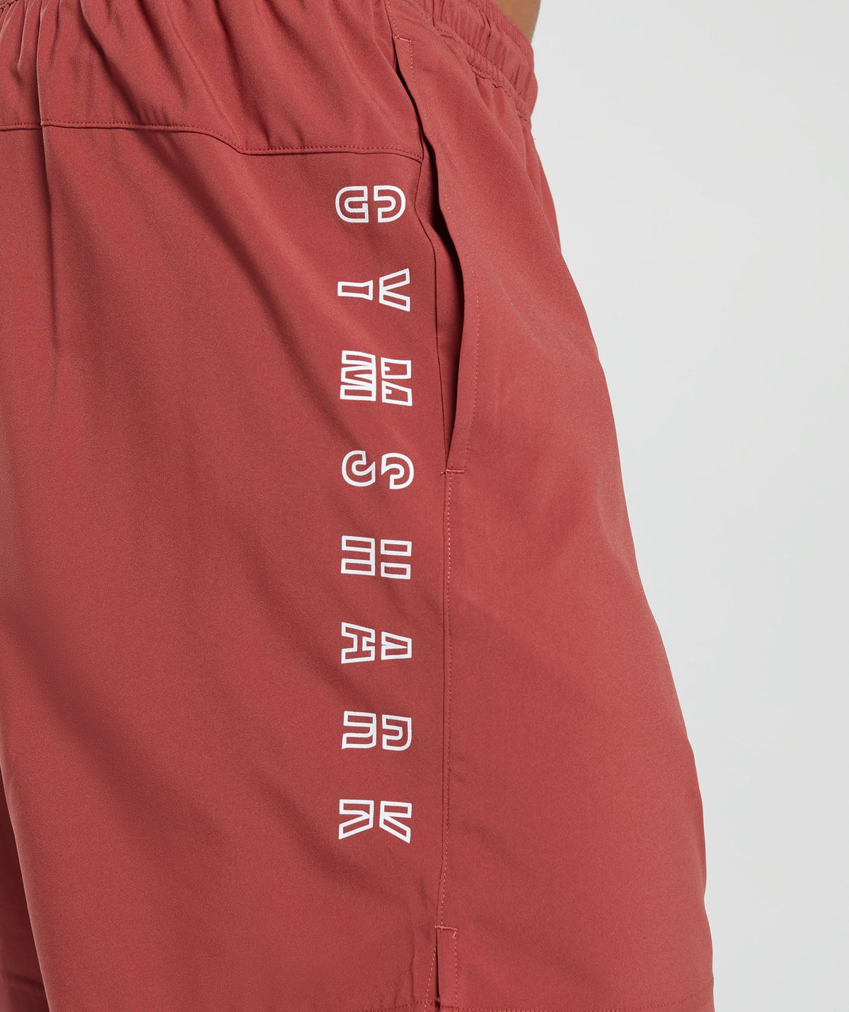 gymshark-strike-shorts-rust-red-aw23