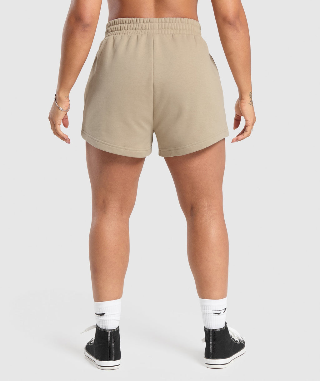 gymshark-strong-girl-lifting-club-graphic-shorts-sand-brown-aw24