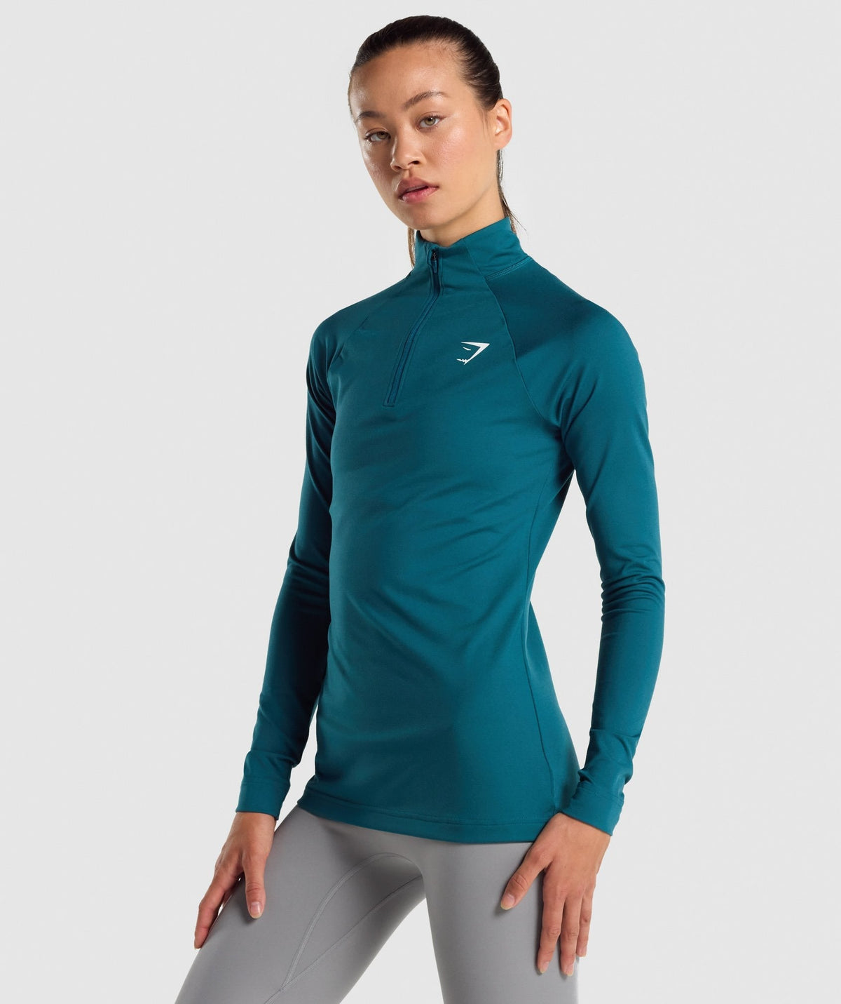 gymshark-training-1-4-zip-niagara-teal