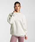 gymshark-training-oversized-sweatshirt-vanilla-white-ss23