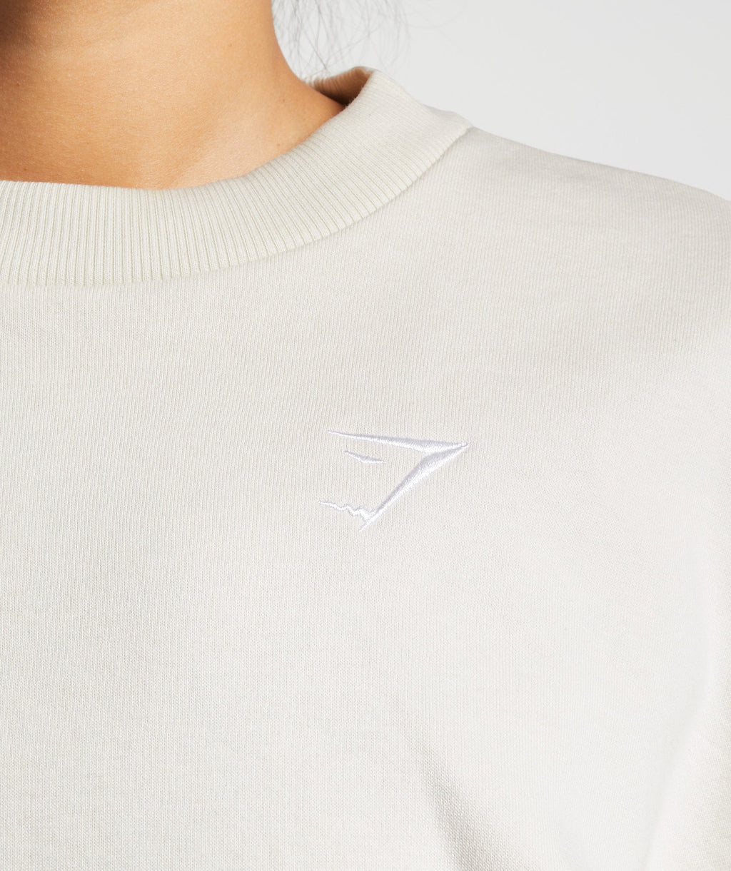 gymshark-training-oversized-sweatshirt-vanilla-white-ss23