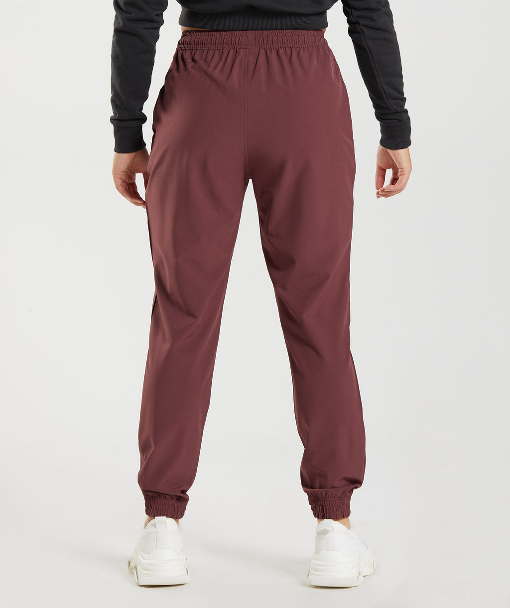 gymshark-training-woven-joggers-cherry-brown-aw22