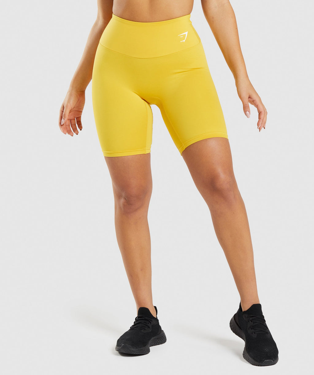 gymshark-training-cycling-shorts-medallion-yellow-ss22