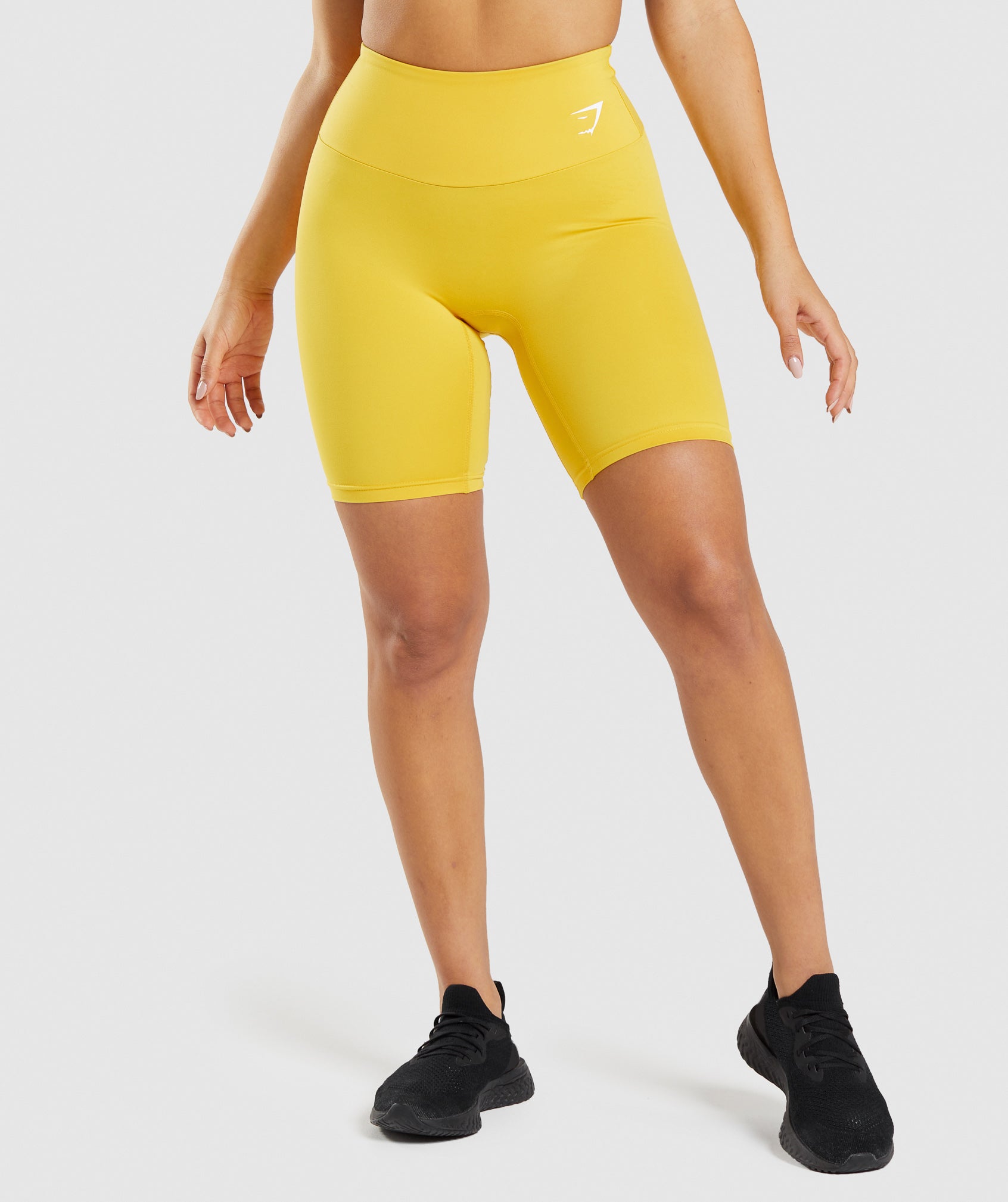 gymshark-training-cycling-shorts-medallion-yellow-ss22