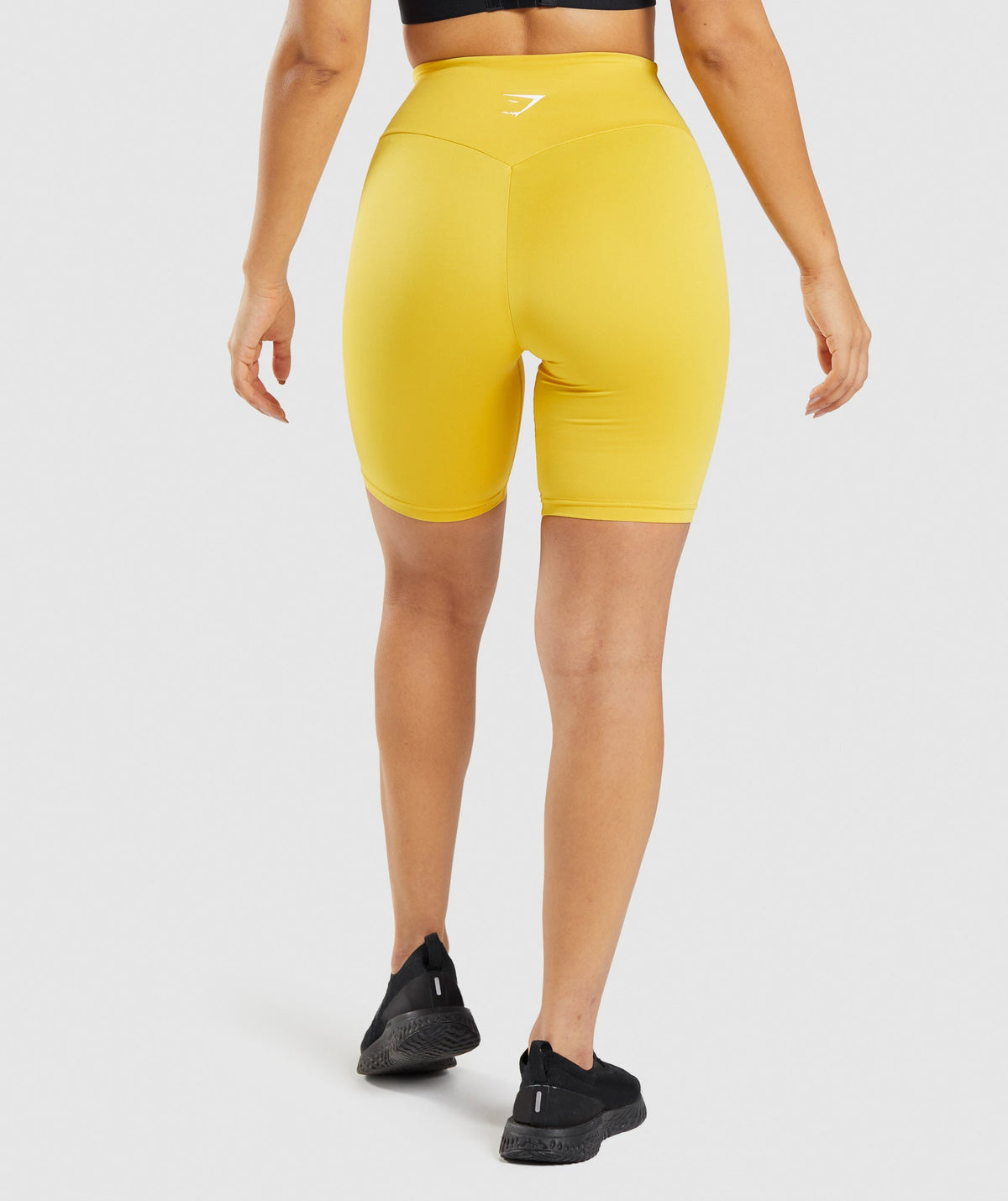 gymshark-training-cycling-shorts-medallion-yellow-ss22
