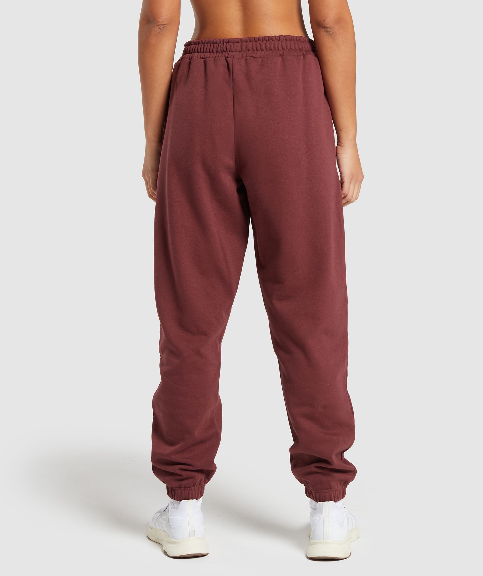 gymshark-training-fleece-joggers-burgundy-brown-ss24
