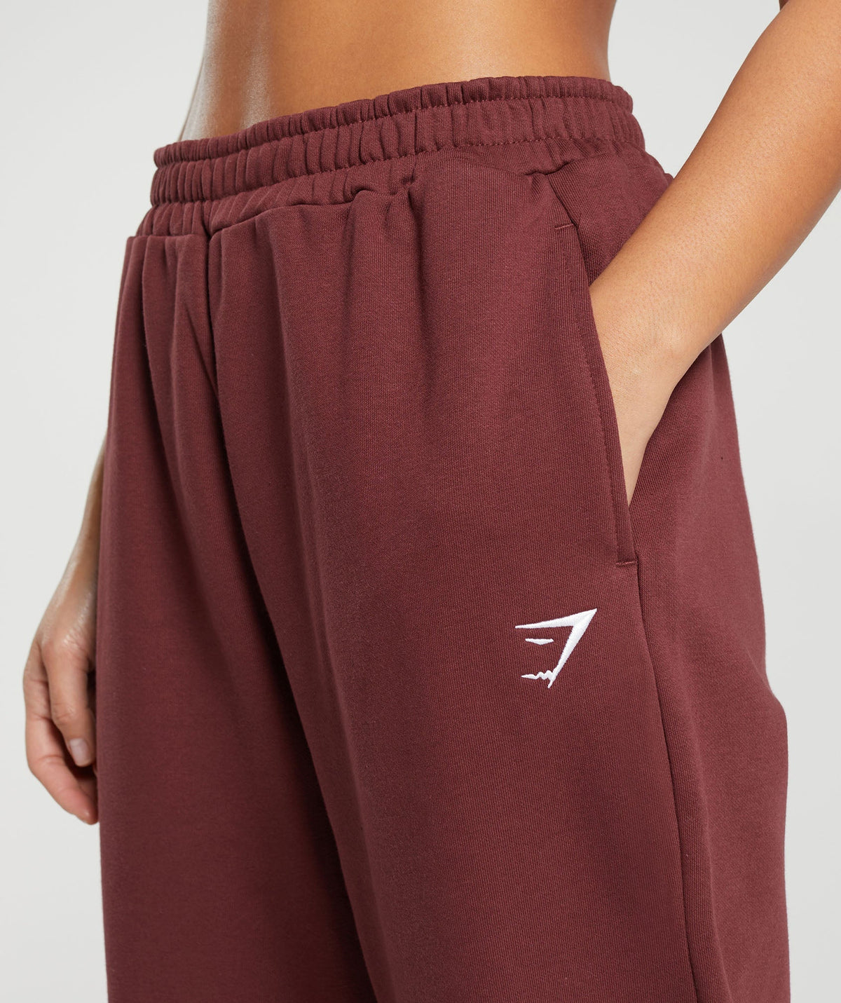 gymshark-training-fleece-joggers-burgundy-brown-ss24