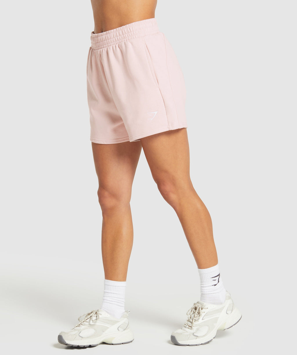 gymshark-training-fleece-shorts-fair-pink-ss25