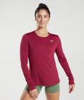 gymshark-training-long-sleeve-top-currant-pink-aw22