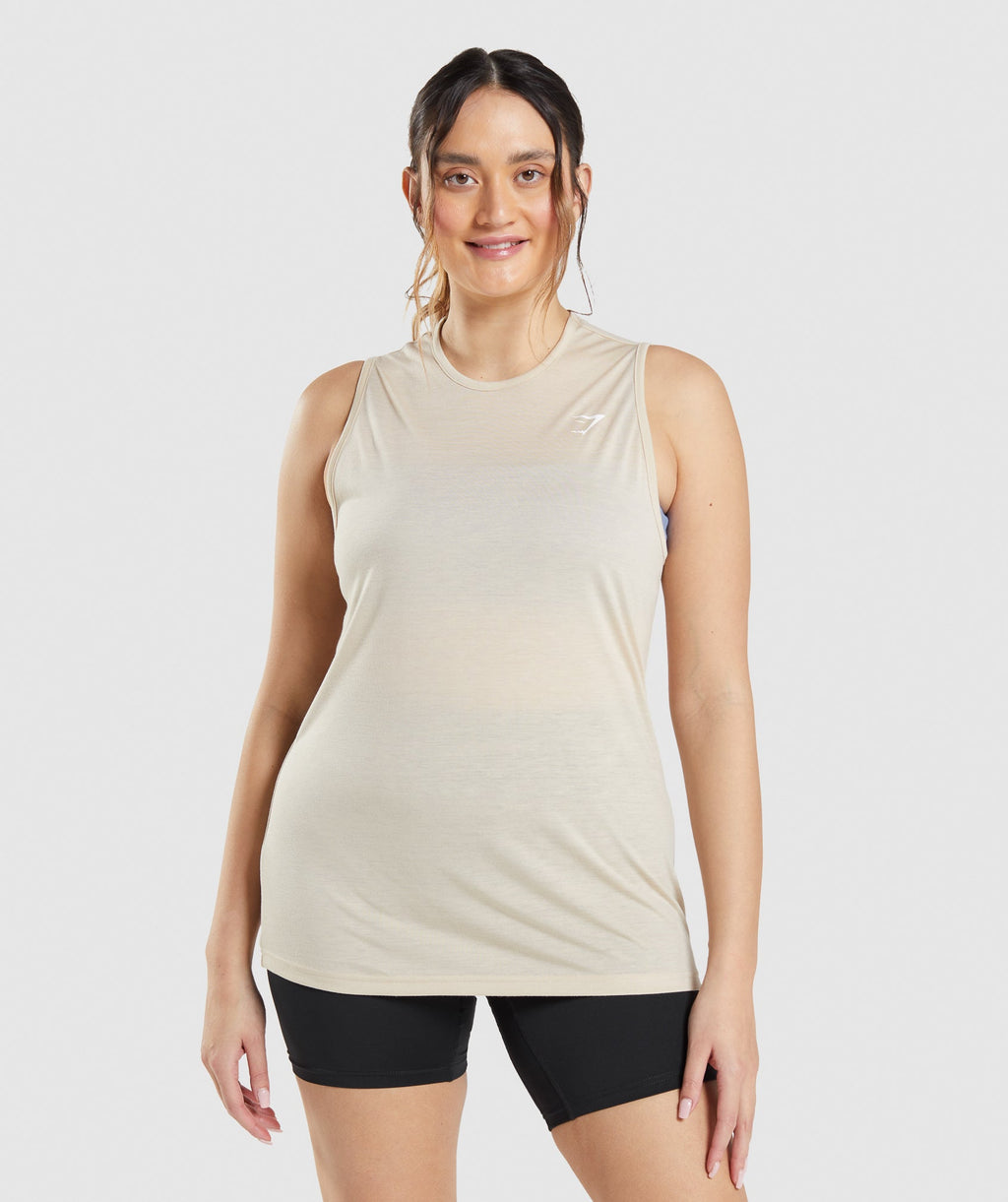 gymshark-training-drop-arm-tank-vanilla-brown-ss22