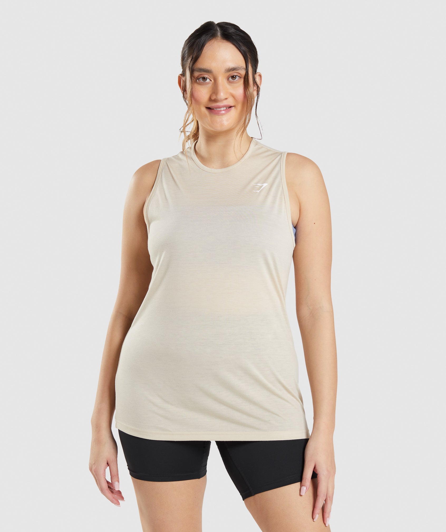 gymshark-training-drop-arm-tank-vanilla-brown-ss22