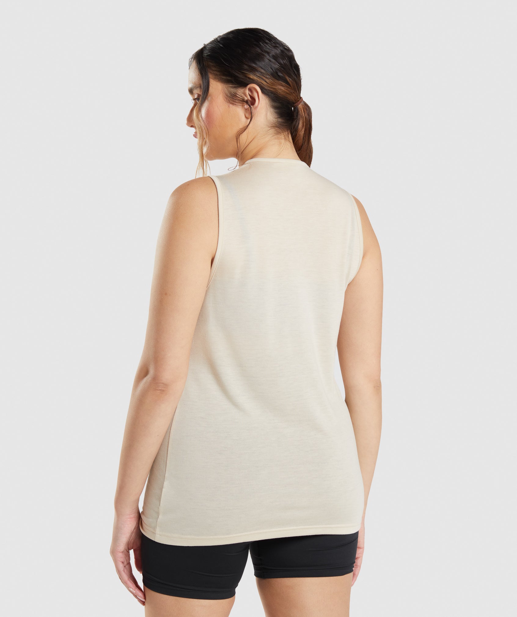 gymshark-training-drop-arm-tank-vanilla-brown-ss22