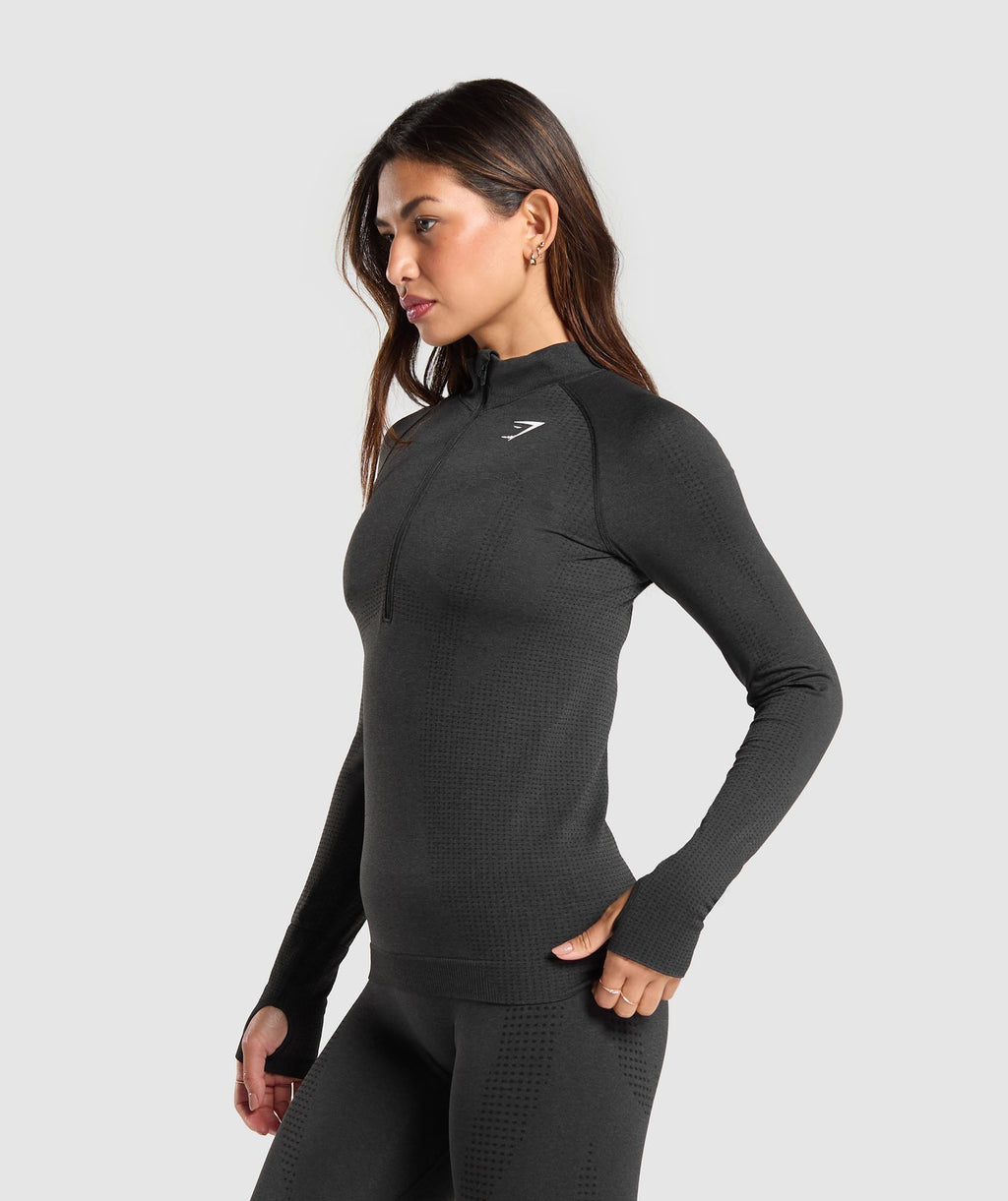 gymshark-vital-seamless-1-2-zip-pullover-black-marl-white-logo